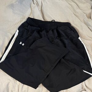 Black and white Under Armour 3XL wind pants.  Black with white stripes down leg